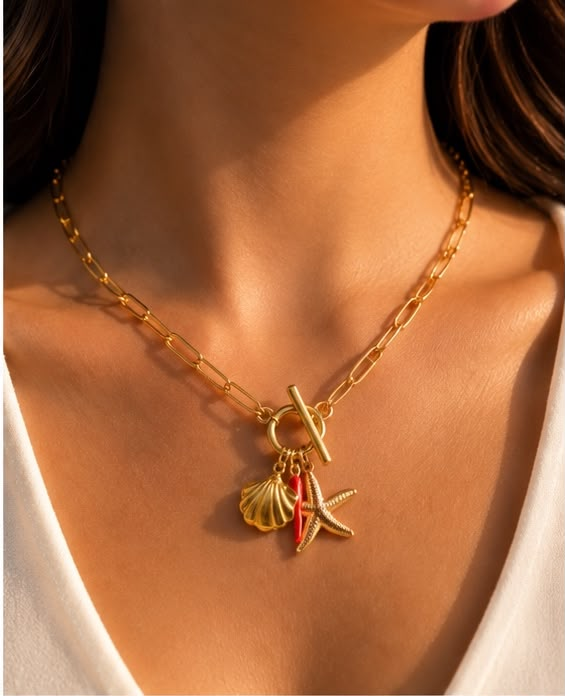 Gold Ocean Charm Necklace with a toggle clasp